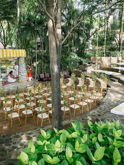 The amphitheater-style seating at Angana the Courtyard provides every guest with a perfect view of the traditional mandap. The natural stone and surrounding greenery are enhanced by my floral designs.