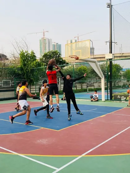 A powerful move to the basket, with a player absorbing contact to finish the play.