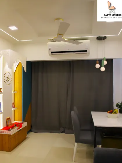A modern and colorful mandir design, using a combination of wood, yellow, and blue panels to create a unique and vibrant prayer space.