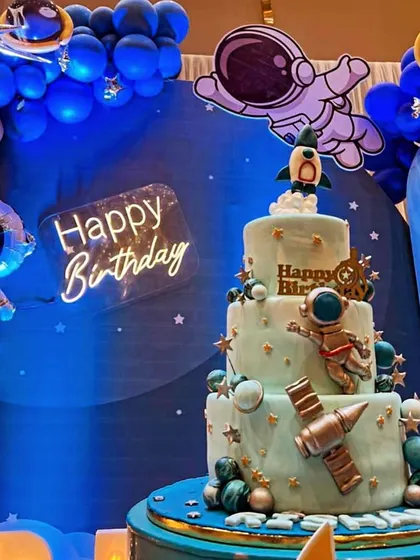 A multi-tiered space exploration cake designed for a grand birthday bash. Featuring fondant astronauts, planets, and a rocket ship, this cake was the highlight of the outer space-themed party.