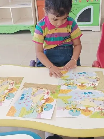 Another group of children engrossed in their puzzle activity, demonstrating focus and persistence.