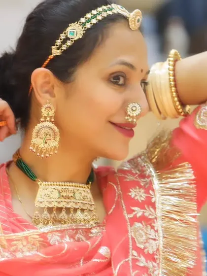 A close-up of the intricate traditional jewelry and costume. I appreciate the artistry of dance in all its forms, including costume and presentation.