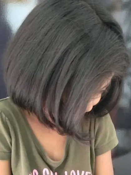 A side view of the cute bob haircut, showing its perfect shape and healthy shine.