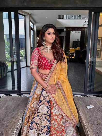 The full view of the multi-colored Sabyasachi lehenga, paired with glamorous makeup for a truly timeless look.
