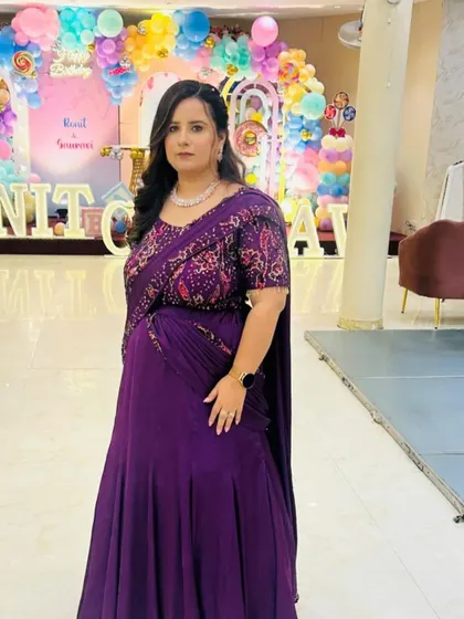 My client looking absolutely regal in this deep purple draped gown. The embroidered blouse and cinched waist create a flattering silhouette that's both traditional and modern.