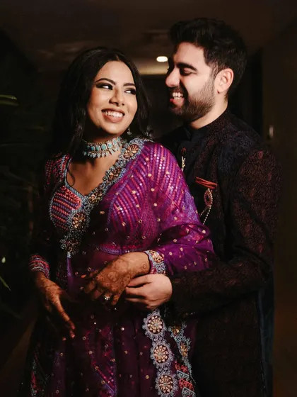A joyful, close-up shot of Aishwarya and Archit. The warm indoor lighting and their bright smiles create a happy and intimate portrait that showcases their chemistry.