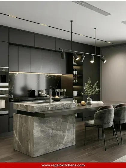 This kitchen is a study in bold, monolithic design. The island and countertops are crafted from a heavy, stone-like material, complemented by dark, flat-panel cabinets. It’s a powerful, architectural approach to kitchen design.