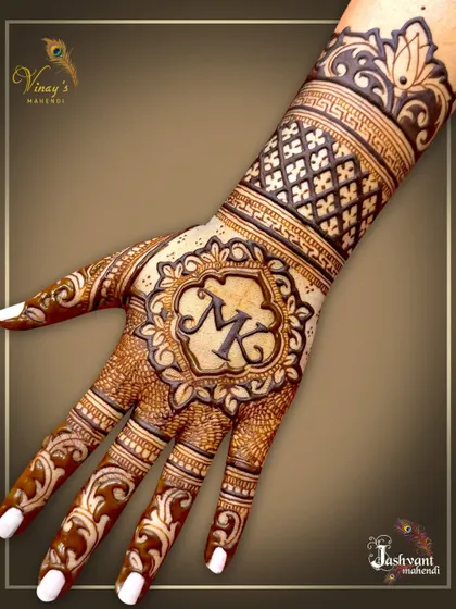 A personalized back-of-hand design with the initials 'MK' in a beautiful floral frame.
