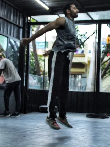 A fighter doing jump squats to build explosive power in his legs. This translates directly to more powerful punches.