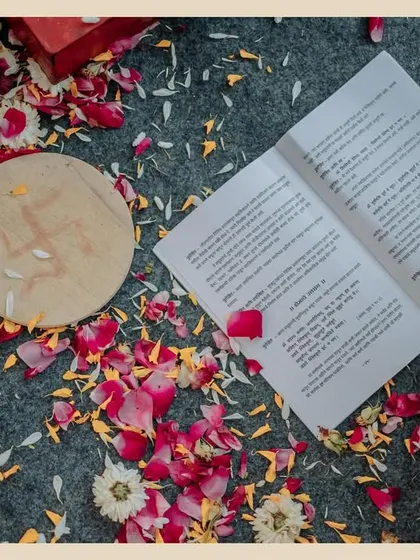 The aftermath of a beautiful ceremony. A shot of the wedding program lying amongst scattered flower petals tells a quiet story about the day that was.