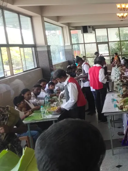 A crucial part of any event is the catering, and I ensure a seamless dining experience. This image shows my professional hospitality staff serving guests at a large-scale event, managing everything from food presentation to service flow.