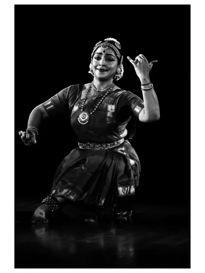 A black and white portrait of Chaitra Rao, capturing the timeless beauty and artistic expression of Indian classical dance.