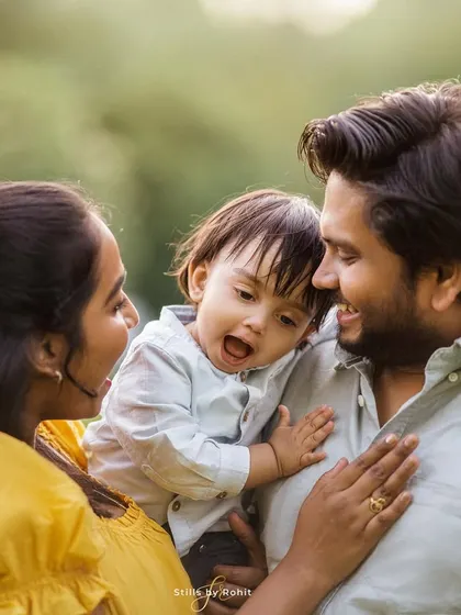 A beautiful reminder that cuddly moments with your little ones are too precious to miss. This close-up shot captures the love and laughter between parents and their baby.