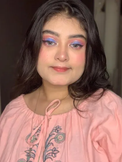 A smiling shot of the pretty pastel makeup.