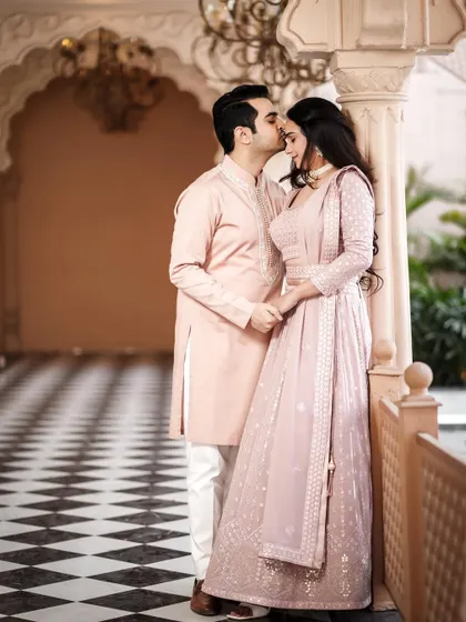 A tender moment in a beautiful hallway. The groom's kiss on the forehead is a classic romantic gesture that I love to capture.