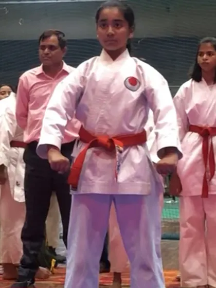 One of my students standing with poise and confidence at a competition. The experience of competing builds resilience and a strong spirit, regardless of the outcome.