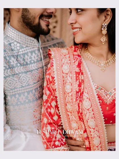 A close-up on the couple's traditional attire and happy smiles, highlighting the rich textures and colors.