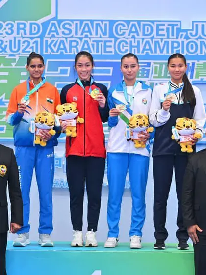 As an official of the Asian Karate Federation, I had the honor of awarding medals to the winners at the 23rd Asian Cadet, Junior & U21 Karate Championship in Shaoguan, China. Here, our athlete stands proudly on the podium.