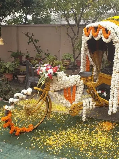 Why have a simple backdrop when you can have a fun, interactive photo booth? This vintage cycle rickshaw, fully decorated with marigold and jasmine garlands, was a huge hit at a mehendi ceremony, adding a touch of quirky charm and creating lots of smiles.