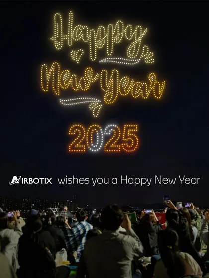 Ringing in the new year with a sky full of light. This show for New Year 2025 features a crowd watching as our drones write a festive message, creating a shared moment of hope and celebration.