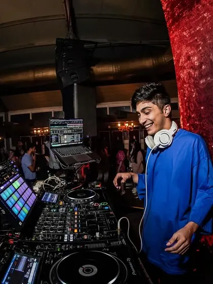 A great shot of me enjoying the vibe from behind the decks. A smiling DJ means the music is hitting just right.