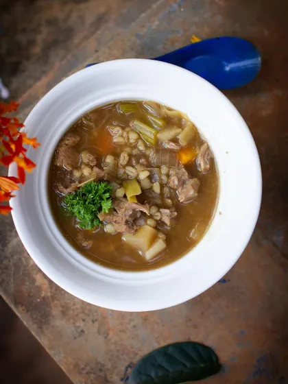 A hearty Scotch broth or lamb stew with barley and root vegetables, a classic from our European cuisine module.