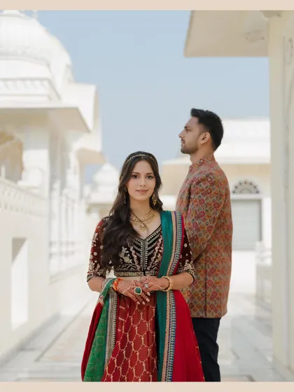 A modern, regal portrait. The couple's pose and the clean architectural lines create a sophisticated and stylish image.