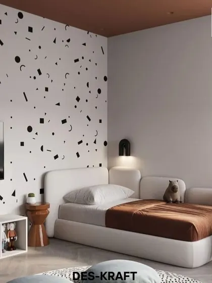 The feature wall with a black-and-white geometric pattern adds a bold, graphic element to the room, contrasting with the soft, curved lines of the bed.