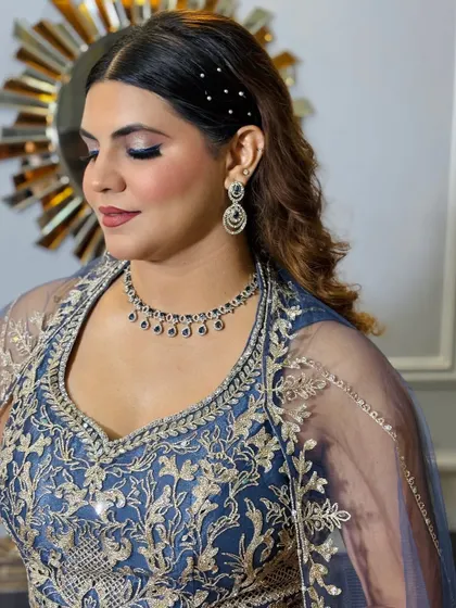 Another beautiful side profile, perfect for showing off both the makeup and the hairstyle.