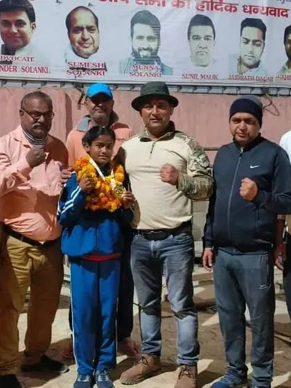 Posing with one of my gold medalists and our supporters at the Delhi Rural Boxing Academy. It takes a team to build a champion, and we have a strong one.