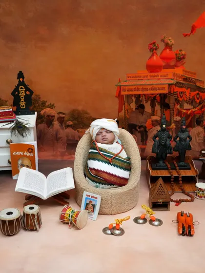 Our Vitthal theme is a tribute to our deep-rooted traditions. This detailed setup for a newborn includes everything from the Vithoba idols and tulsi plant to the tiny cymbals and dholki, creating a truly spiritual and culturally rich portrait.