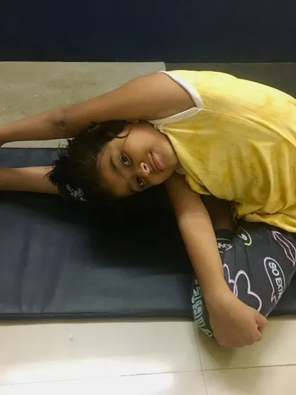 Another young student showing great progress in Parivrtta Janu Sirsasana.