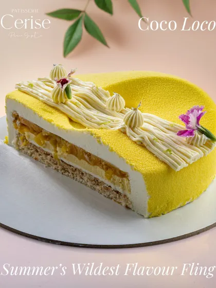 This is my Coco Loco entremet, a cross section of summer's wildest flavour fling. It brings together the tang of pineapple and passionfruit with the creaminess of coconut and white chocolate, all wrapped in a light vanilla mousse.