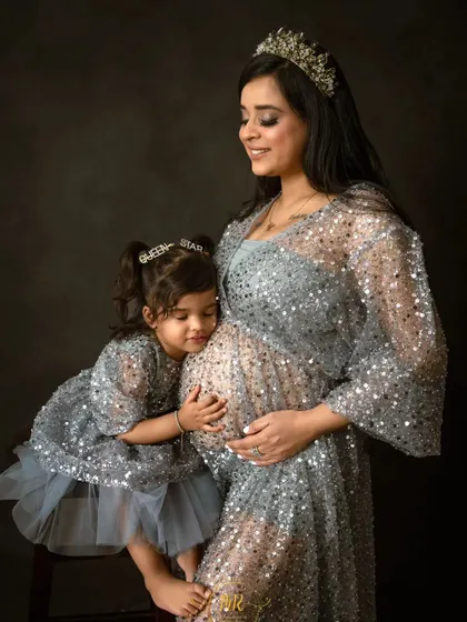 A beautiful moment as an older sister connects with her new sibling on the way. I love including the whole family in maternity sessions to celebrate this special time of transition.