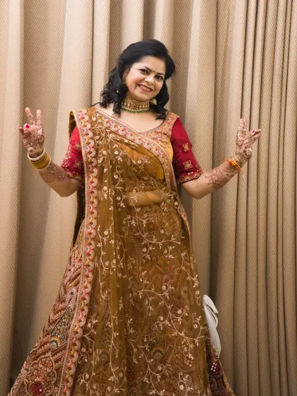 A joyful bridal portrait capturing a fun "peace sign" gesture, showing the bride's happy and relaxed personality.