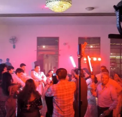 Guests enjoying the party, with cold pyro adding a special effect.
