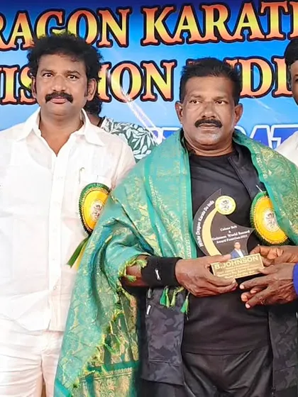 Receiving an honor at a prestigious award ceremony. I am grateful for the recognition from my peers in the martial arts community.