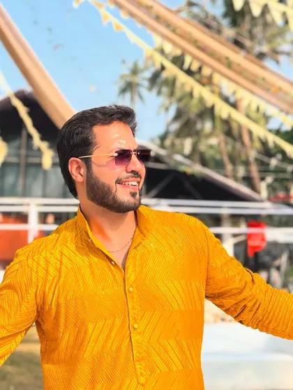 Enjoying the sunny weather and the beautiful setup of a beachside Haldi ceremony.
