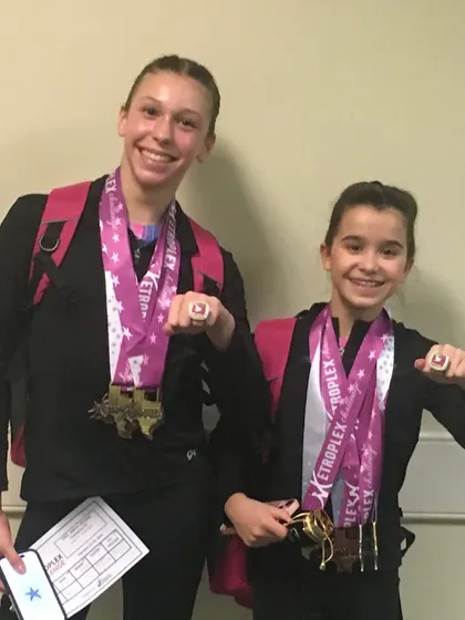 More champions! These athletes are thrilled to show off their medals and rings from the Metroplex Challenge.