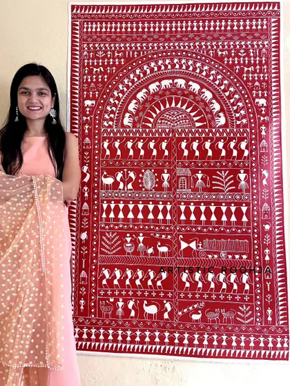 This large, intricate Warli painting tells a complete story of village life, from farming to festivals. It's a great example of a detailed, narrative piece that can be a conversation starter in any home.