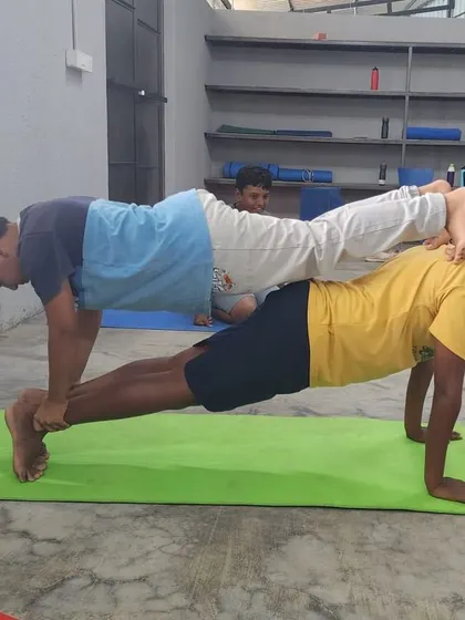 Another example of the double plank, a staple exercise for building full-body strength and teamwork.
