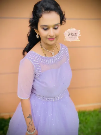 A pretty party makeup look in a lavender gown. The makeup is soft and shimmery, with a focus on the eyes to match the outfit.