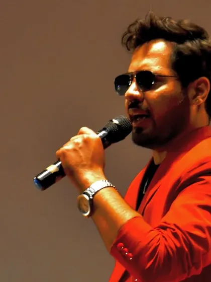 A close-up shot while speaking on stage. Clear communication and a commanding presence are key to holding the attention of a large crowd.
