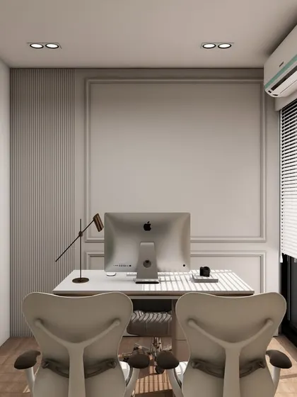 A minimalist private office featuring a clean white desk against a wall with classic moulding details. The design is elegant and timeless, perfect for a professional who values understated style.