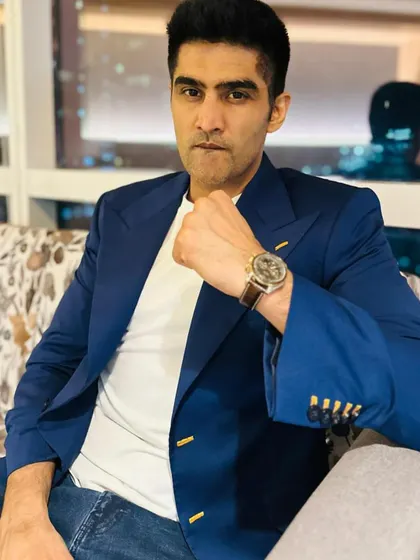 I designed this classic blue formal jacket for Vijender Singh. The piece is elevated by handcrafted detailing over the buttonholes and wide golden buttons, turning a timeless staple into a work of art.