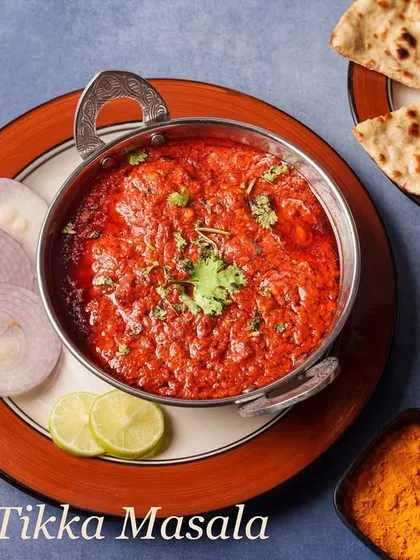 A world-famous classic, our Chicken Tikka Masala features grilled chicken tikka pieces simmered in a rich, creamy, and spiced tomato-based gravy. It's the ultimate comfort food.