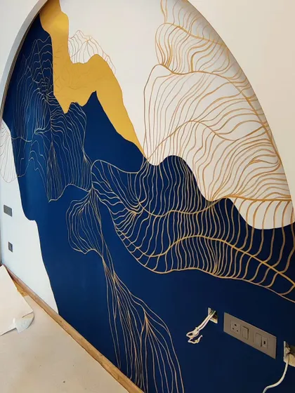 A side view of the abstract mural, emphasizing the curve of the arch and the dynamic composition of the artwork.