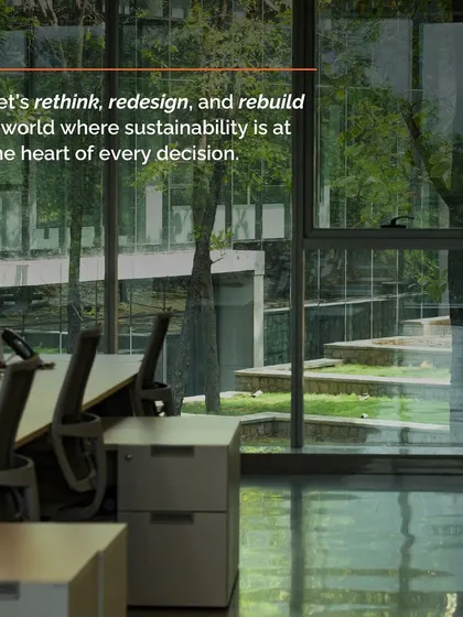 An office view through a window to a lush green exterior, reinforcing our message to rethink, redesign, and rebuild a world where sustainability is at the heart of every decision.