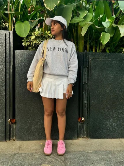 My casual, comfy style outside the gym. A sweatshirt and a tennis skirt is a classic look. It's all about balance.