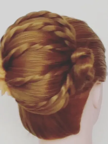 A side view of an intricate updo featuring twists and braids that wrap around the head. This style is elegant from all angles and works beautifully for both traditional and contemporary outfits.